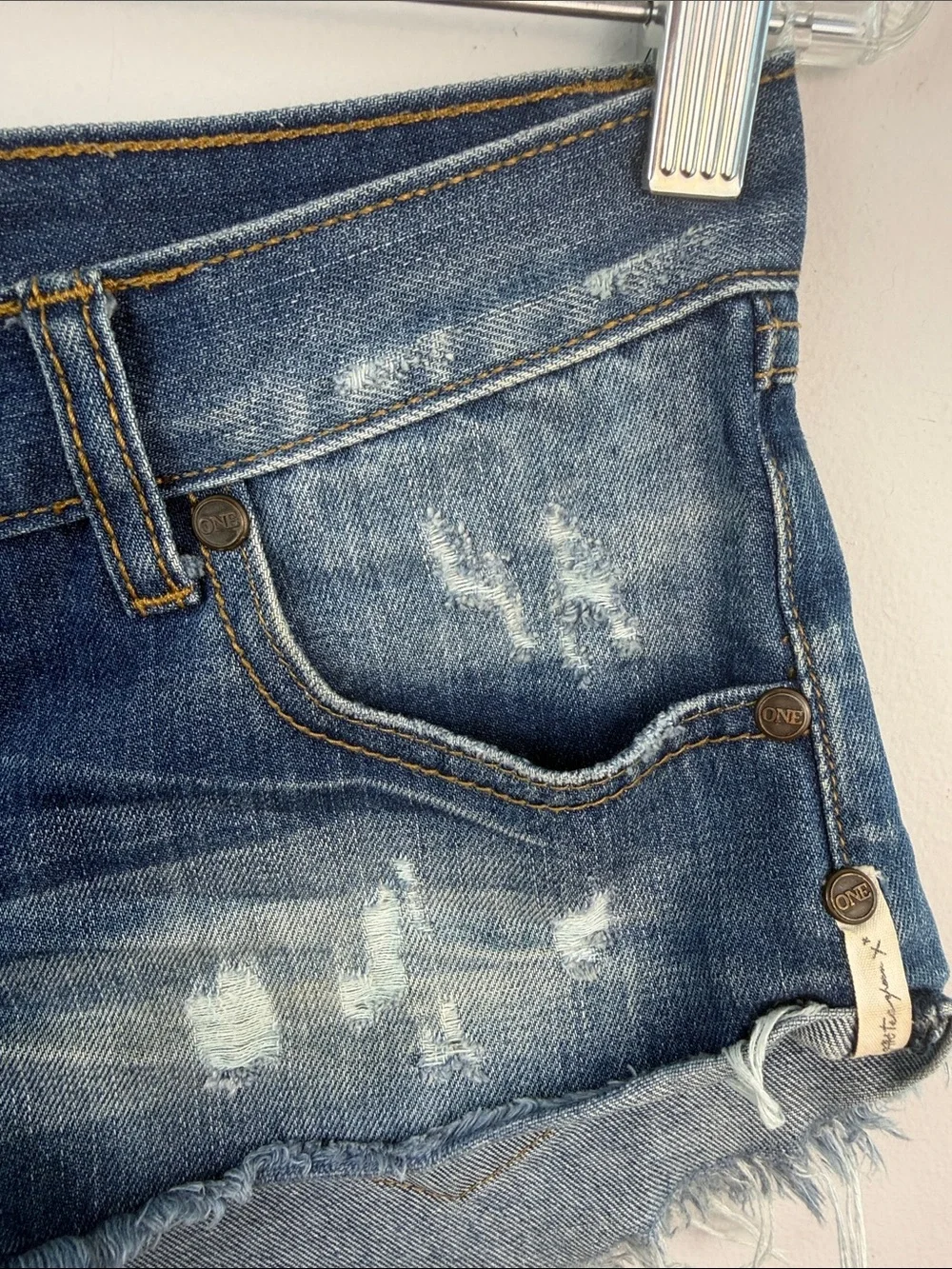 One Teaspoon NO 2’s Low Rise Jean Shorts 8” Rise Raw Curved Hem Sz 25 Distressed